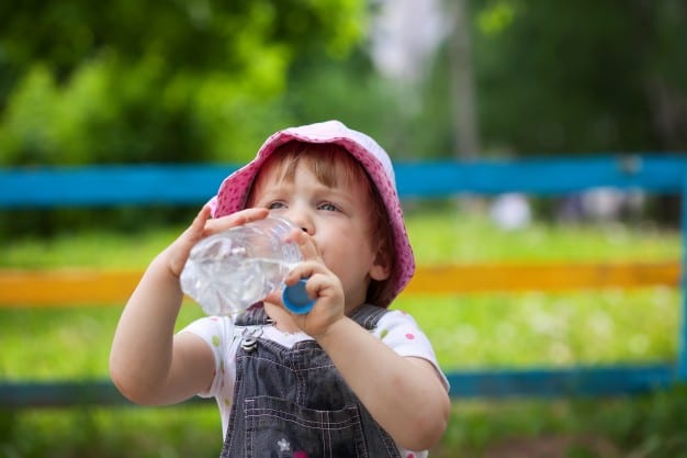 child drinking from the bottle