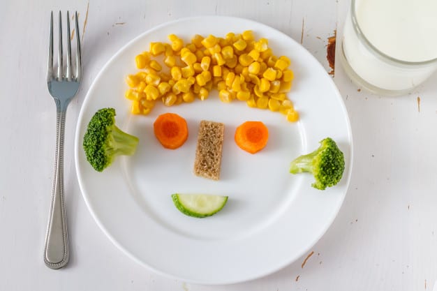 fruits and vegetables arranged attractively on the plate