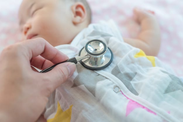 checking baby with a stethoscope